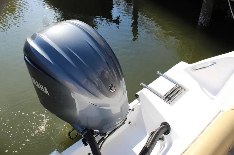 Slide: The Image of 2023 Sportsman Heritage 231 Center Console with Yamaha outboard motor on water. - 41