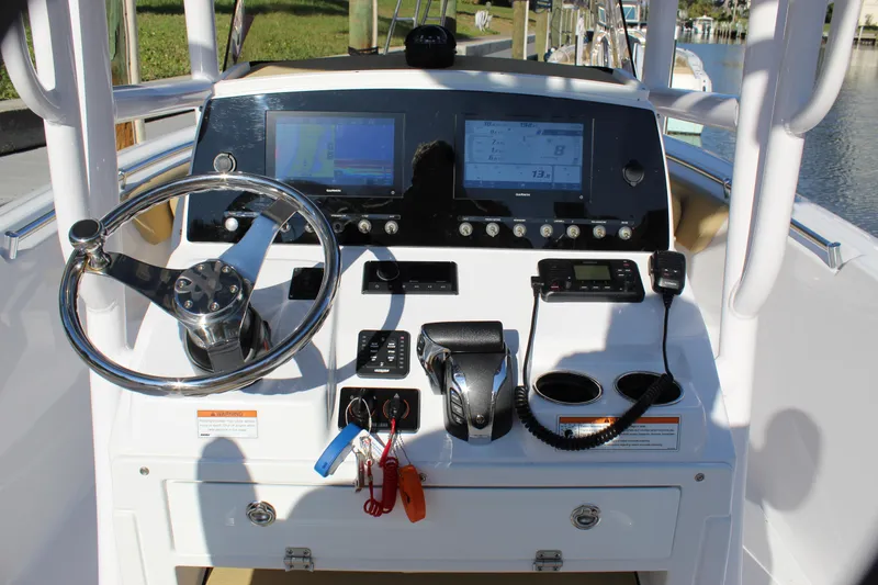 Slide: The Image of 2023 Sportsman Heritage 231 Center Console dashboard with steering wheel and navigation screens. - 42
