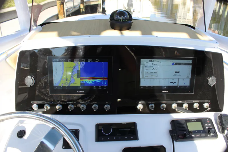 Slide: The Image of 2023 Sportsman Heritage 231 Center Console dashboard with navigation and control systems. - 43
