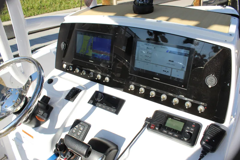 Slide: The Image of 2023 Sportsman Heritage 231 Center Console dashboard with navigation and control systems. - 45