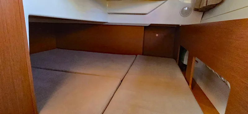 Slide: The Image of Interior cabin of 2016 Jeanneau Merry Fisher 855 with cozy sleeping area. - 11