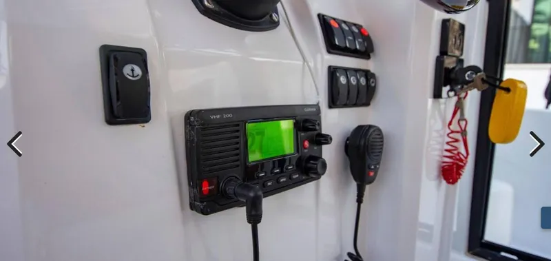 Slide: The Image of Control panel of 2016 Jeanneau Merry Fisher 855 boat with radio and switches. - 26