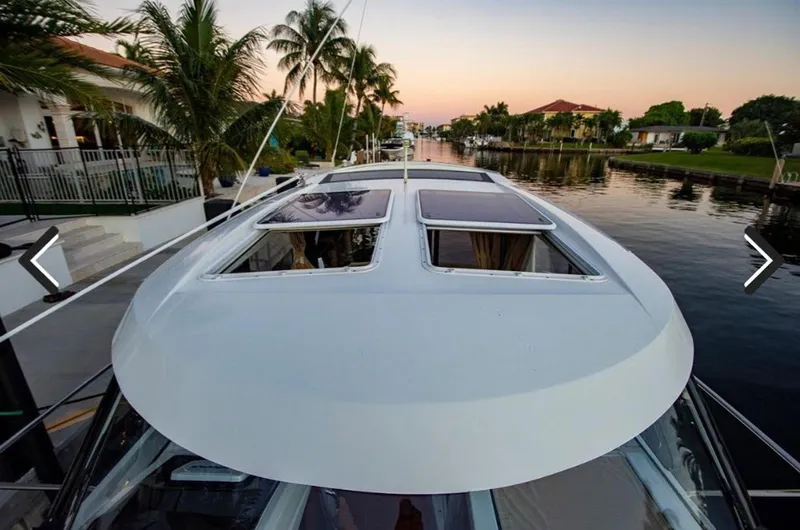 Slide: The Image of 2016 Jeanneau Merry Fisher 855 boat on a scenic canal at sunset. - 36