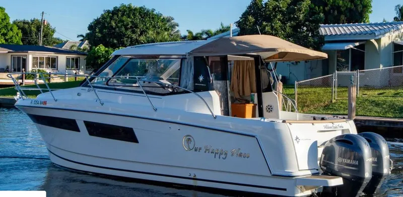 Slide: The Image of 2016 Jeanneau Merry Fisher 855 boat docked by waterfront homes. - 38
