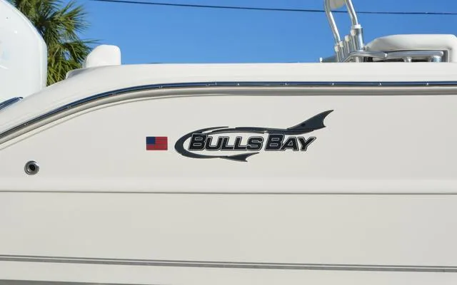 Slide: The Image of 2025 Bulls Bay 200 CC boat with logo and American flag decal. - 11