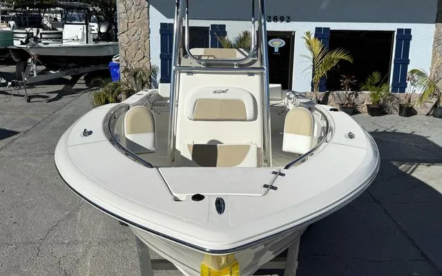 Slide: The Image of 2025 Bulls Bay 200 CC boat, front view, parked outdoors near a building. - 14