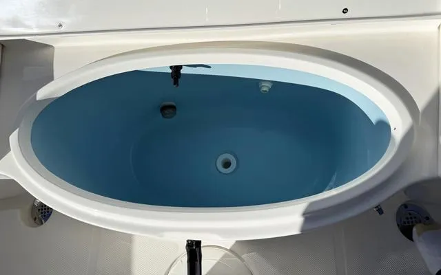 Slide: The Image of Livewell on 2025 Bulls Bay 200 CC boat, featuring a blue interior. - 17