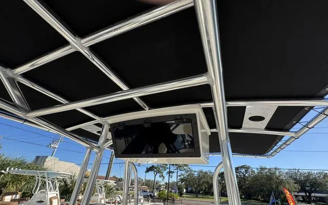 Slide: The Image of 2025 Bulls Bay 200 CC boat with T-top and electronics display. - 19