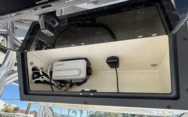 Slide: The Image of 2025 Bulls Bay 200 CC boat compartment with Garmin device and wiring. - 20