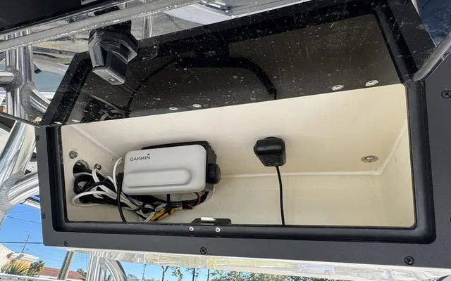 Slide: The Image of Storage compartment in 2025 Bulls Bay 200 CC boat with Garmin device and wiring. - 21