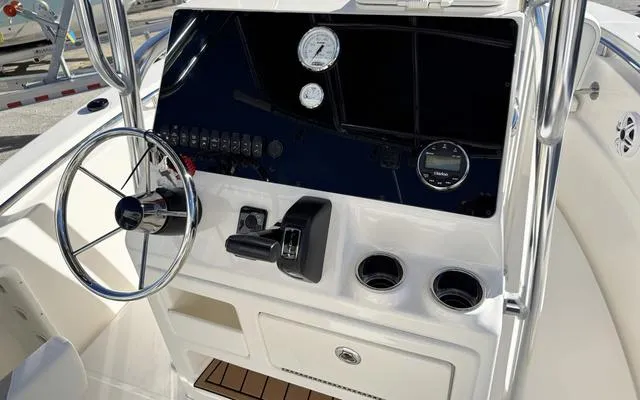 Slide: The Image of 2025 Bulls Bay 200 CC boat console with steering wheel and gauges. - 22