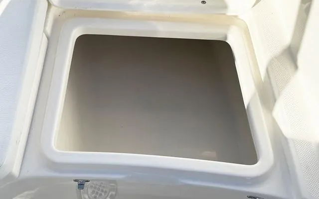 Slide: The Image of Bulls Bay 200 CC 2025 boat storage compartment, open and empty. - 29