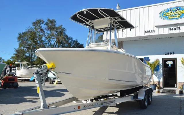 Slide: The Image of 2025 Bulls Bay 200 CC boat on trailer outside marine dealership. - 3