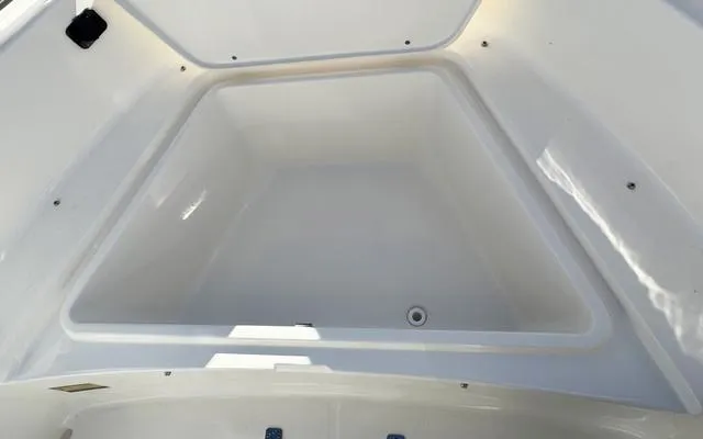 Slide: The Image of 2025 Bulls Bay 200 CC boat interior storage compartment, white and spacious design. - 30