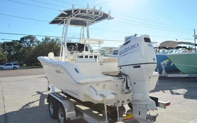 Slide: The Image of 2025 Bulls Bay 200 CC boat with Suzuki engine on trailer, parked outdoors. - 5