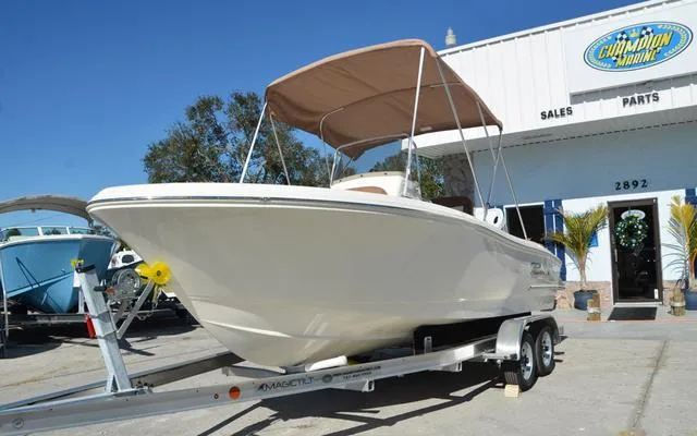 Slide: The Image of 2025 Pioneer 202 Islander boat on trailer outside dealership. - 1