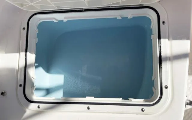 Slide: The Image of Livewell compartment of 2025 Pioneer 202 Islander boat, open and empty. - 18