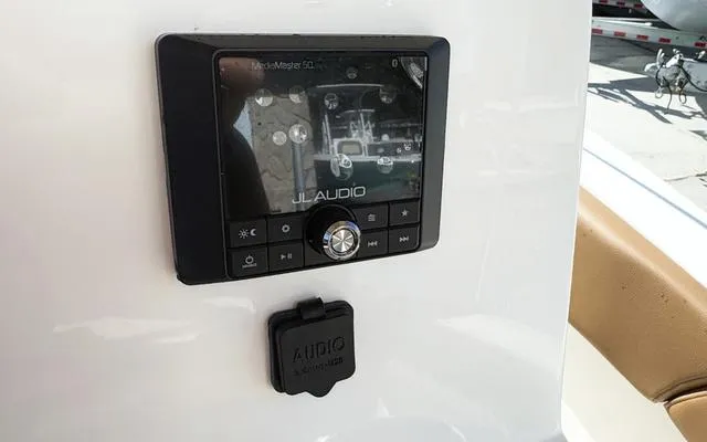 Slide: The Image of JL Audio system on 2025 Pioneer 202 Islander boat dashboard. - 25