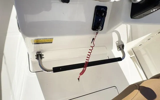 Slide: The Image of 2025 Pioneer 202 Islander boat cockpit with safety features and control panel. - 26