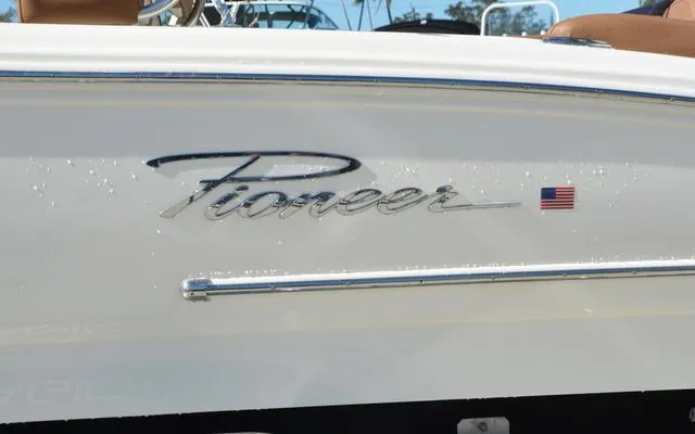 Slide: The Image of 2025 Pioneer 202 Islander boat with logo and American flag emblem. - 5