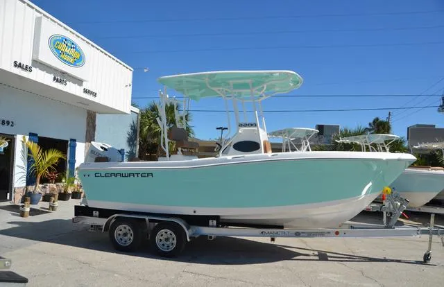 Slide: The Image of 2025 Clearwater 2200 boat on trailer outside dealership. - 13