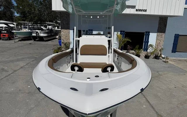 Slide: The Image of 2025 Clearwater 2200 boat, sleek design, docked at marina service area. - 14