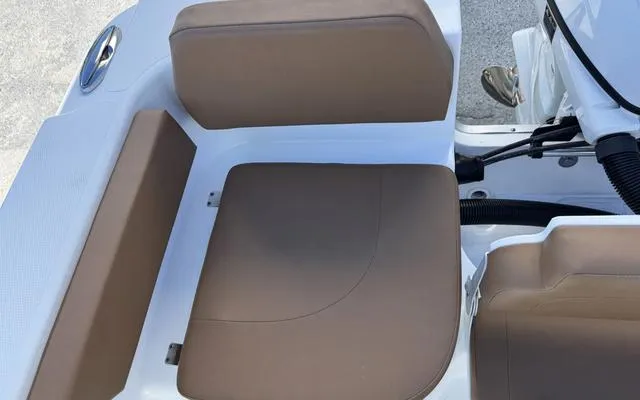 Slide: The Image of Brown and white seating on a 2025 Clearwater 2200 boat. - 16