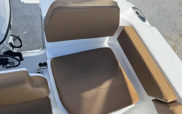 Slide: The Image of Brown seating on 2025 Clearwater 2200 boat, featuring comfortable cushions and sleek design. - 20