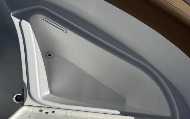 Slide: The Image of Interior compartment of a 2025 Clearwater 2200 boat, featuring sleek design and storage space. - 30