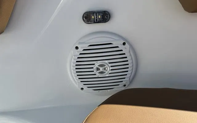 Slide: The Image of Boat speaker and light on Clearwater 2200, 2025 model, with beige seating. - 33