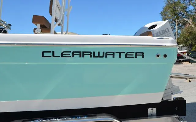 Slide: The Image of 2025 Clearwater 2200 boat with Suzuki engine, light blue hull, on trailer. - 7