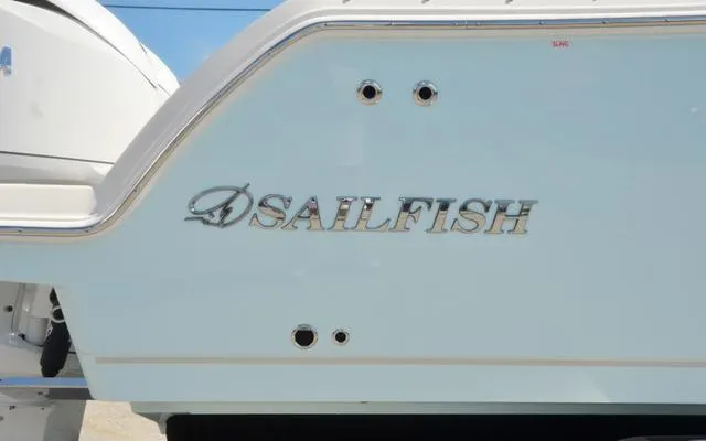 Slide: The Image of 2025 Sailfish 276 DC boat, close-up of logo on hull. - 11