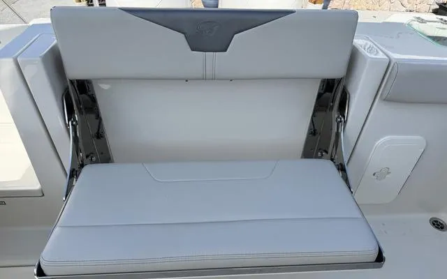 Slide: The Image of 2025 Sailfish 276 DC boat seat, gray upholstery, foldable design. - 17