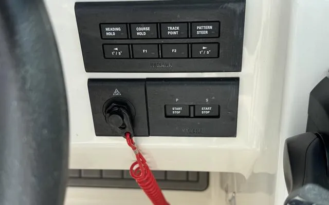 Slide: The Image of Control panel of 2025 Sailfish 276 DC boat with various navigation buttons. - 32