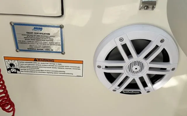 Slide: The Image of 2025 Sailfish 276 DC yacht certification and warning labels with speaker detail. - 36