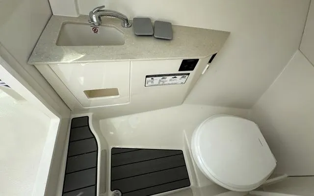 Slide: The Image of 2025 Sailfish 276 DC boat bathroom with sink and toilet. - 39
