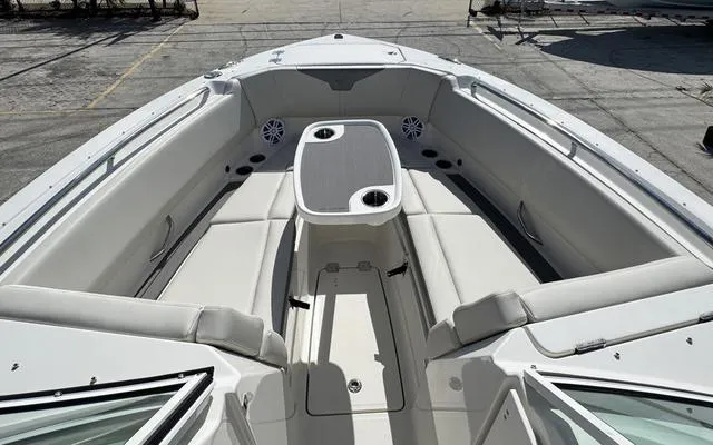 Slide: The Image of 2025 Sailfish 276 DC boat interior with seating and table. - 40