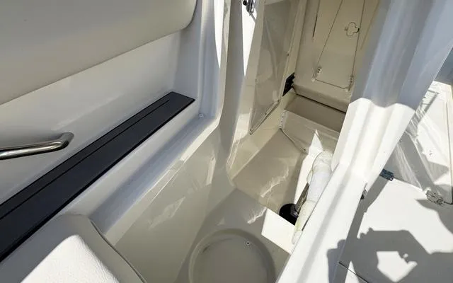 Slide: The Image of 2025 Sailfish 276 DC boat interior, featuring sleek white design and modern amenities. - 41
