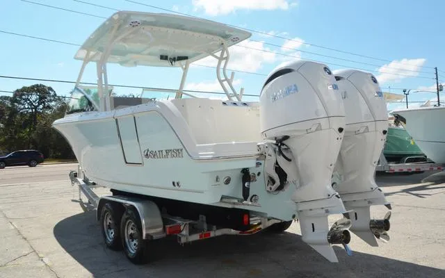 Slide: The Image of 2025 Sailfish 276 DC boat with dual engines on a trailer. - 5