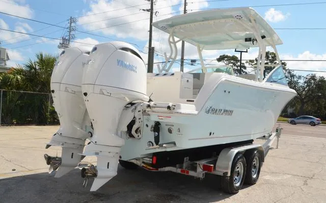 Slide: The Image of 2025 Sailfish 276 DC boat with dual Yamaha engines on a trailer. - 7