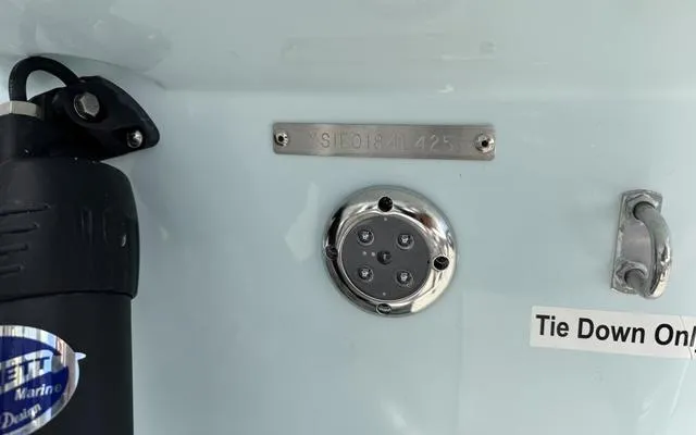 Slide: The Image of 2025 Sailfish 276 DC boat detail with tie-down and marine equipment. - 9