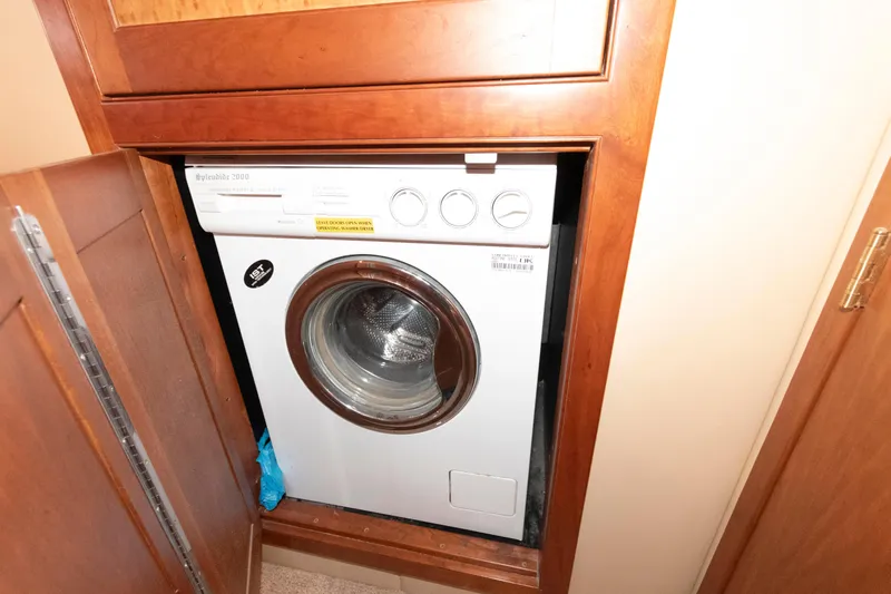 Slide: The Image of Built-in washing machine on 2003 Cruisers Yachts 5370 Express. - 19