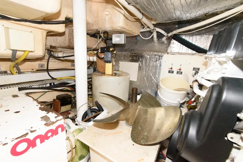 Slide: The Image of Engine room of 2003 Cruisers Yachts 5370 Express with visible propeller and equipment. - 26