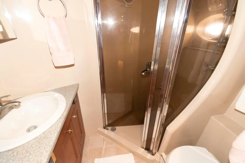 Slide: The Image of Bathroom interior of 2003 Cruisers Yachts 5370 Express with shower and sink. - 17