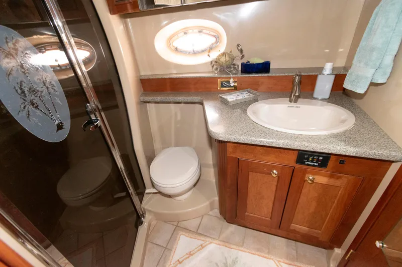Slide: The Image of Luxurious bathroom in 2003 Cruisers Yachts 5370 Express with modern fixtures and elegant design. - 21