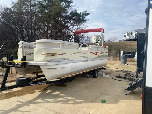 Slide: The Image of 2008 Voyager Pontoons 22 Sport Cruise on trailer, parked outdoors. - 2