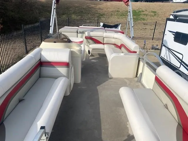 Slide: The Image of 2008 Voyager Pontoons 22 Sport Cruise with spacious seating and red accents. - 4