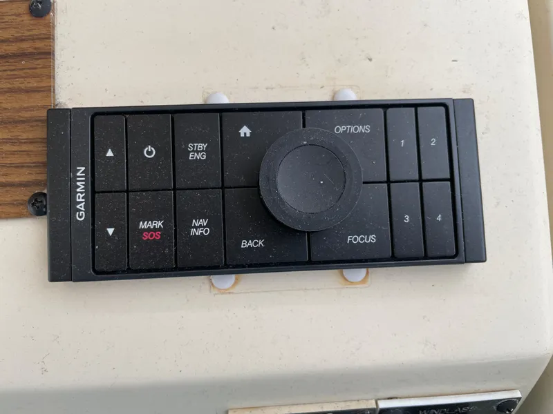 Slide: The Image of Garmin control panel on 2006 Mainship Pilot 34 boat dashboard. - 15