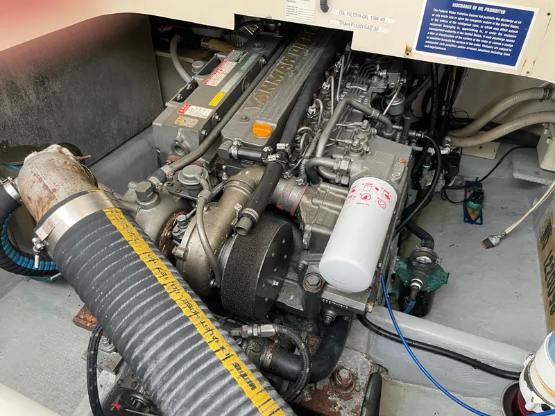 Slide: The Image of Engine compartment of a 2006 Mainship Pilot 34 boat, showcasing mechanical components. - 30