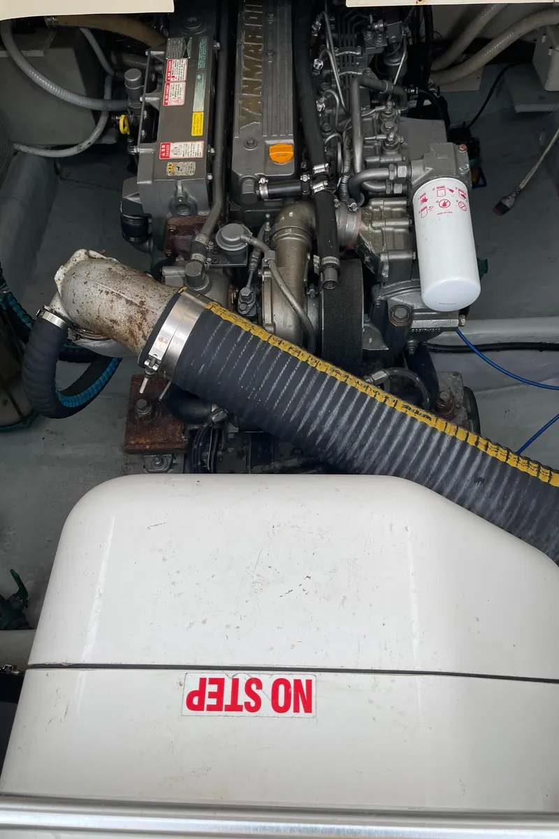 Slide: The Image of Engine compartment of a 2006 Mainship Pilot 34 boat, featuring visible components and "No Step" label. - 31